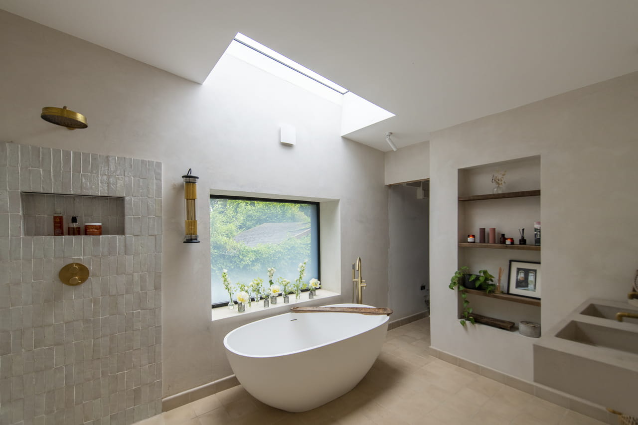 Bright bathroom with VELUX flat roof windxow